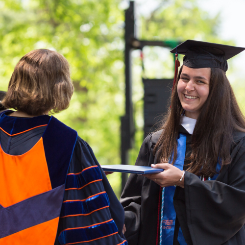 Sydney Braat crossing the stage at Commencement.